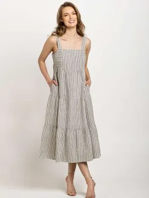 Light gray and white striped tiered dress with wide straps, designed with pockets and a timeless silhouette.