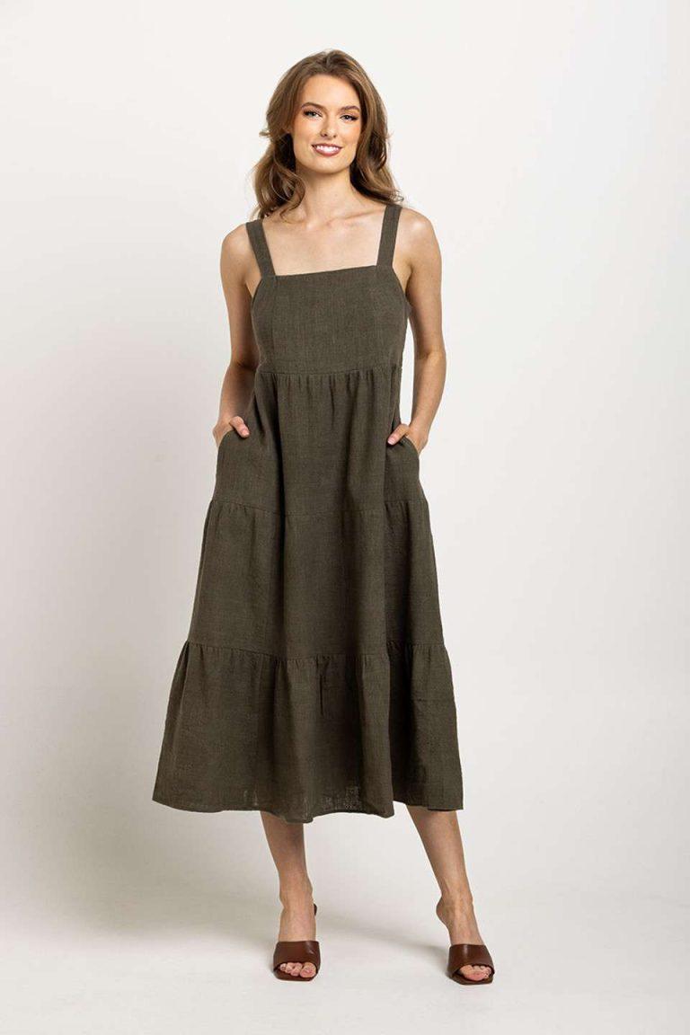 Deep olive tiered dress with a square neckline and pockets, emphasizing Colouron Cotton's slow fashion values.
