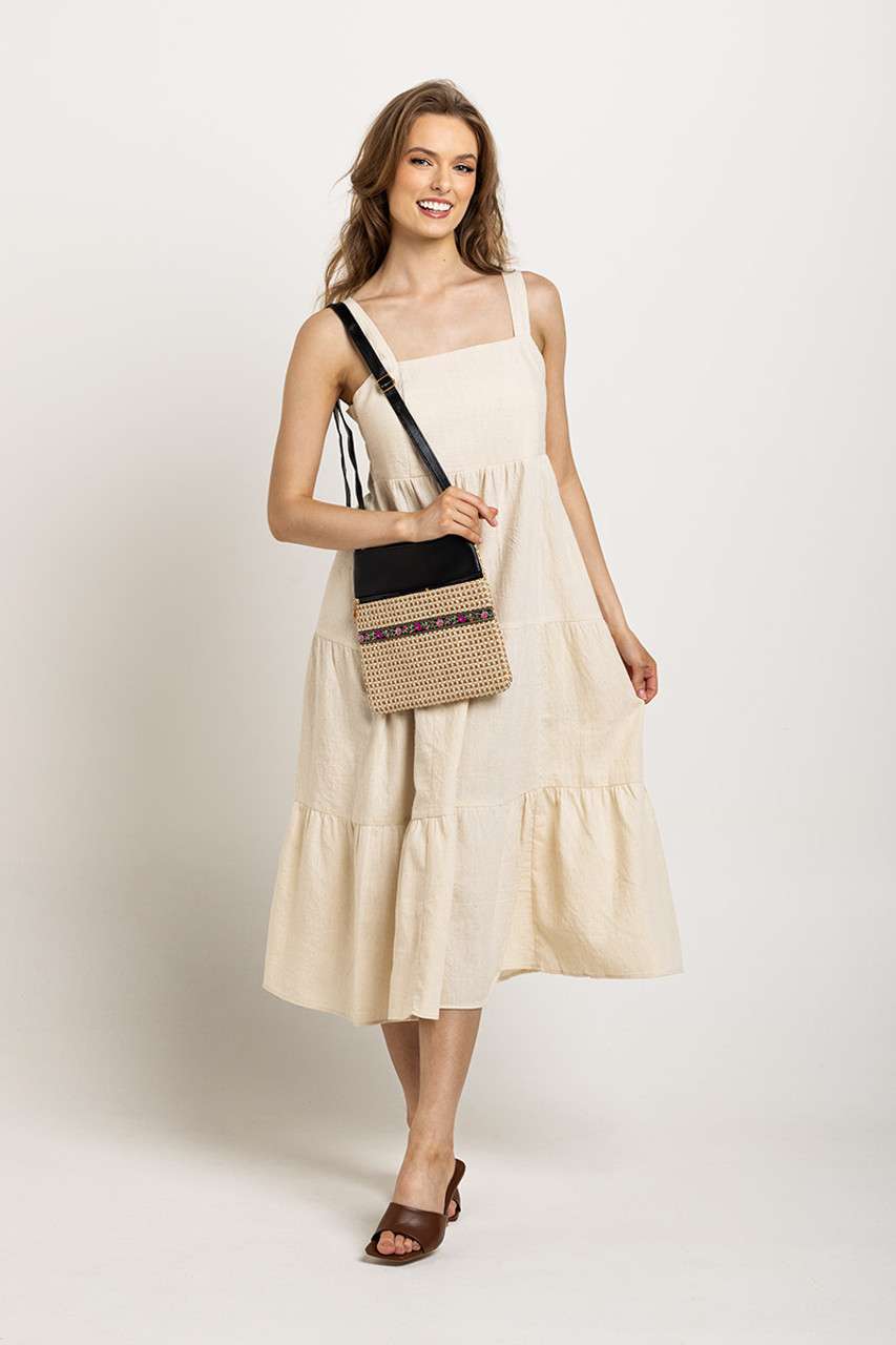 Cream, tiered midi dress with wide straps and pockets, perfect for an easy-going, sustainable wardrobe staple.