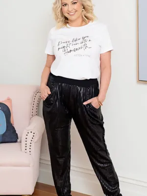 Astor and Tyne Black Jogger Pants - Sleek black jogger pants with a subtle sheen, featuring a herringbone-like texture for a modern, elevated look.