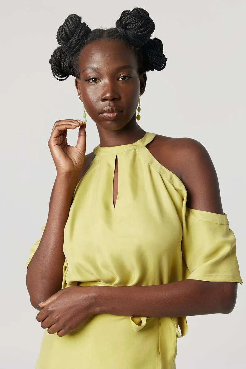 Yellow halter-neck dress: Minimalist cold-shoulder design with a waist tie for sustainable everyday elegance.