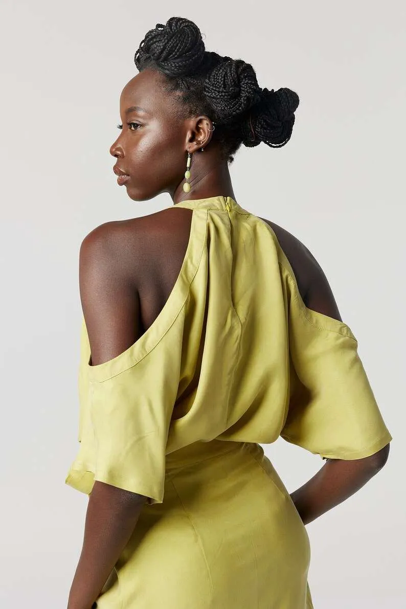 Yellow halter-neck dress: Minimalist cold-shoulder design with a waist tie for sustainable everyday elegance.